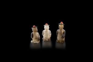 Three Chinese crystal snuff bottles in the form of small boys, early 20th century