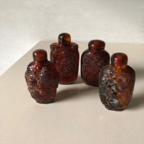 Four Chinese amber snuff bottles, early 20th century