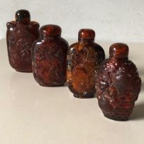 Four Chinese amber snuff bottles, early 20th century