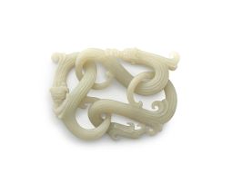 A Chinese jade carving of intertwined reticulating dragons, late 19th/early 20th century