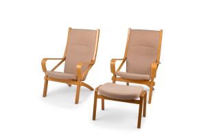 A pair of Hans J. Wegner 'Model JH477' ash plywood and teak easy chairs with ottoman, designed 1986, manufactured by Johannes Hansen, Denmark