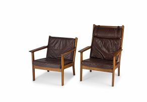 A pair of Hans J. Wegner 'Model GE265' lady's and gentleman's solid oak and brown leather armchairs, designed 1976, manufactured by Getama, Denmark