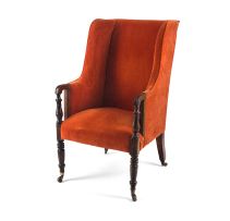 An upholstered and mahogany wingback armchair, 19th century