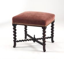 A walnut and upholstered occasional stool