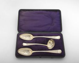 A pair of George III silver Old English pattern serving spoons and a pierced sugar sifter, Thomas & William Chawner, London, 1767