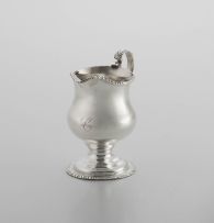 A George III silver milk jug, maker’s marks worn, London, possibly 1765