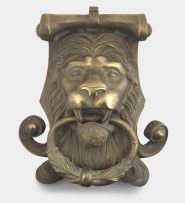 A Victorian brass lion mask door knocker