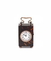 An Edwardian tortoiseshell and silver-mounted carriage time piece, retailed by Carrington & Co.
