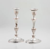 A pair of Sheffield plate neo-classical style candlesticks, 19th century