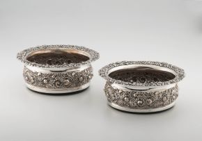 A pair of late Victorian silver-plate wine coasters
