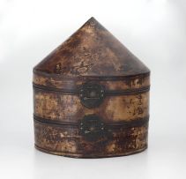 A Chinese lacquered leather two-tiered hat box, early 20th century