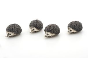 Four silver hedgehogs, .900 standard