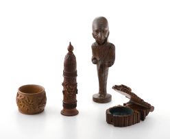 A carved wooden pipe stopper and stand, late 19th/early 20th century