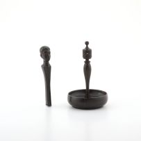 A turned ebony figural ring stand, early 20th century
