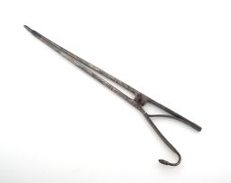 A pair of steel tongs, 19th century