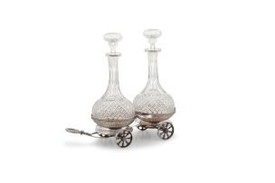 A Sheffield silver-plate double coaster trolley and decanters, maker’s initials ‘H & Co’, 19th century