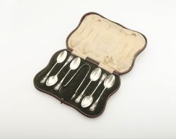 An Edward VII cased set of six silver coffee spoons and a pair of silver sugar tongs, Elkington & Co Ltd, Birmingham, 1910