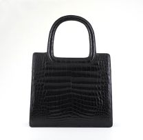 A French black crocodile handbag, circa 1961