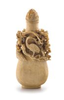 A Chinese ivory snuff bottle and stopper, Qing Dynasty, late 19th/early 20th century