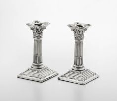 A pair of late Victorian silver candlesticks, Thomas A Scott, Sheffield, 1900