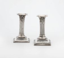 A pair of Edward VII silver candlesticks, Henry Matthews, London, 1906