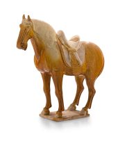 A brown-glazed pottery figure of a horse, Tang Dynasty, 618-907