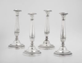 A pair of Prussian silver candlesticks, maker’s initials ‘HG’, pre-1886, .750 standard, with import marks for Vienna and the Netherlands, early 20th century