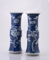 A pair of Chinese blue and white Gu-form vases, Qing Dynasty, late 19th/early 20th century