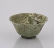 A Chinese carved spinach jade bowl, Qing Dynasty, 19th century