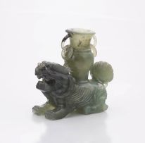 A Chinese jade carving of a Dog of Fo and vase, 20th century