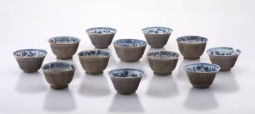 A group of twelve Chinese blue and white café-au-lait tea bowls, Qianlong period (1735-1796)