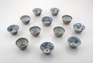 A group of twelve Chinese blue and white café-au-lait tea bowls, Qianlong period (1735-1796)