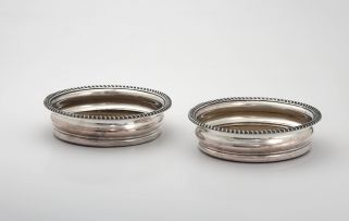 A pair of silver-plate wine coasters, 19th century