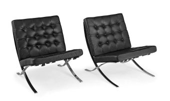 A pair of 'Barcelona' black leather and chrome chairs, designed by Mies van der Rohe in 1929, of later manufacture, 1980s