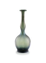 An Art Nouveau iridescent green glass bottle vase