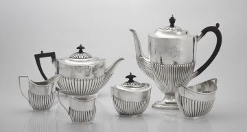 A Victorian silver three-piece tea service, Goldsmiths & Silversmiths Co, Sheffield, 1885