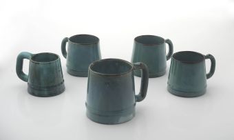 A Ceramic Studio green-glazed tankard