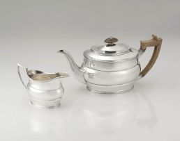 A George V silver teapot and creamer, R & S Garrard & Co, London, 1922 and 1930