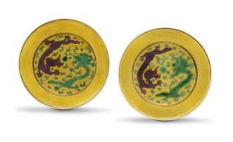 A pair of yellow-ground, aubergine and green-enamelled ‘dragon’ saucer dishes, Guangxu marks and period, 1875-1908
