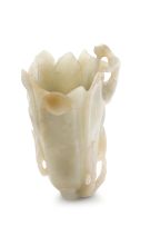 A Chinese pale celadon jade carving of a ‘magnolia’ vase, Qing Dynasty, late 18th/ early 19th century