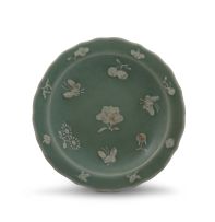 A Chinese celadon moulded dish, Qing Dynasty, 19th century