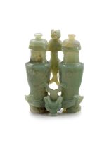 A Chinese celadon jade ‘champion vase’ and covers, late Qing Dynasty