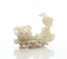A Chinese pale celadon jade carving of a crane, Qing Dynasty, 19th century