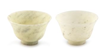 Two Chinese pale celadon carved jade cups, Qing Dynasty, late 19th century