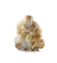 A Chinese pale celadon jade carving of a young boy, Qing Dynasty, 19th century