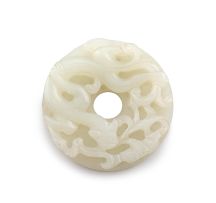 A Chinese white jade bi disc, Qing Dynasty, 18th century