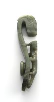 A Chinese mottled green jade belt hook, Qing Dynasty, 19th century