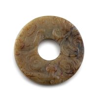 A Chinese celadon jade bi disc, Qing Dynasty, 19th century
