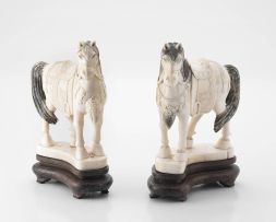 A pair of Chinese ivorine horses, 20th century