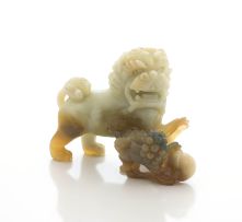 A Chinese pale cream and russet bowenite dog-of-fo and its pup, early 20th century